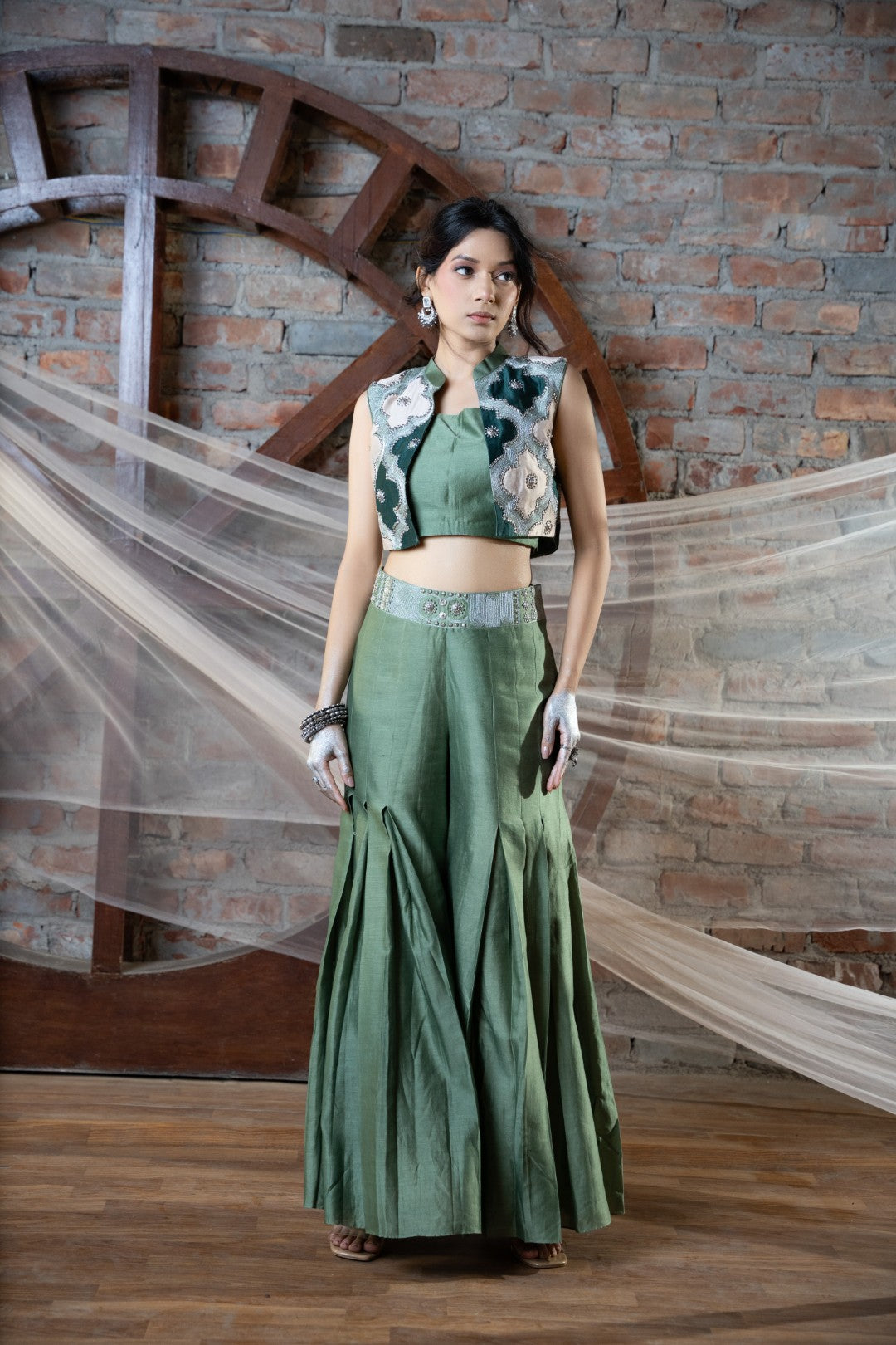 Green appliqué short jacket and plazo set with bustier
