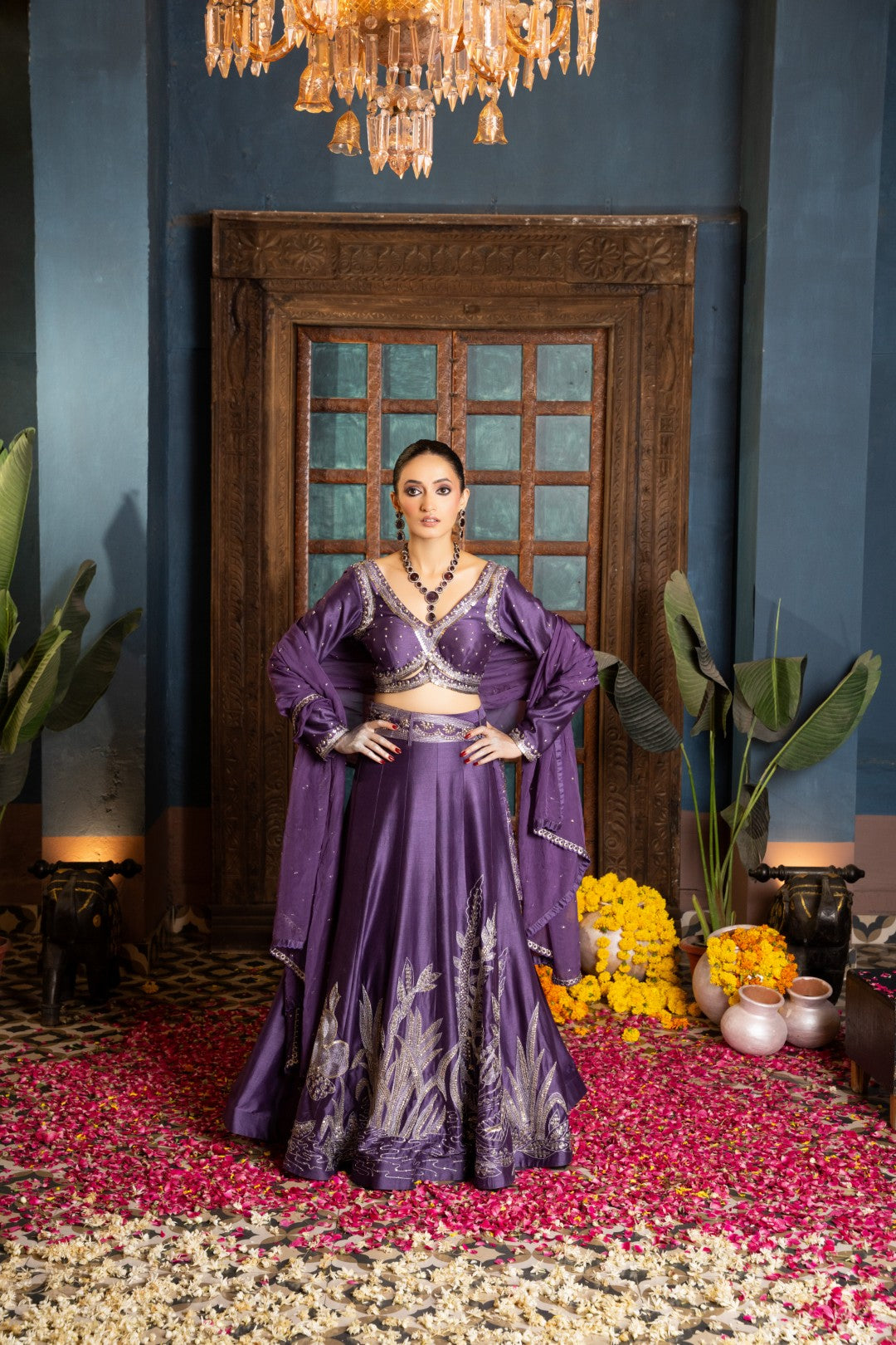 Purple lehenga paired with bralette and dupatta