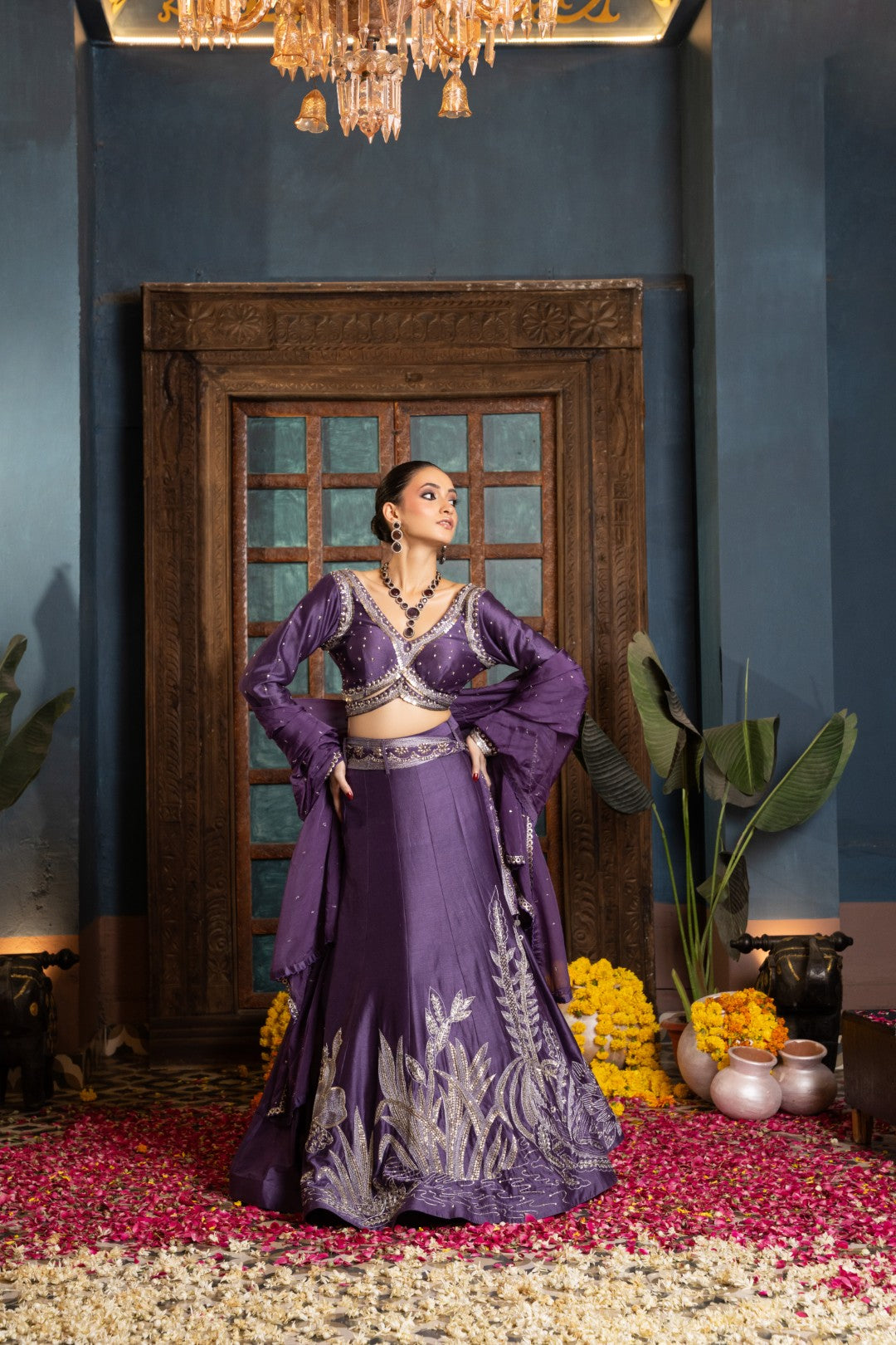 Purple lehenga paired with bralette and dupatta