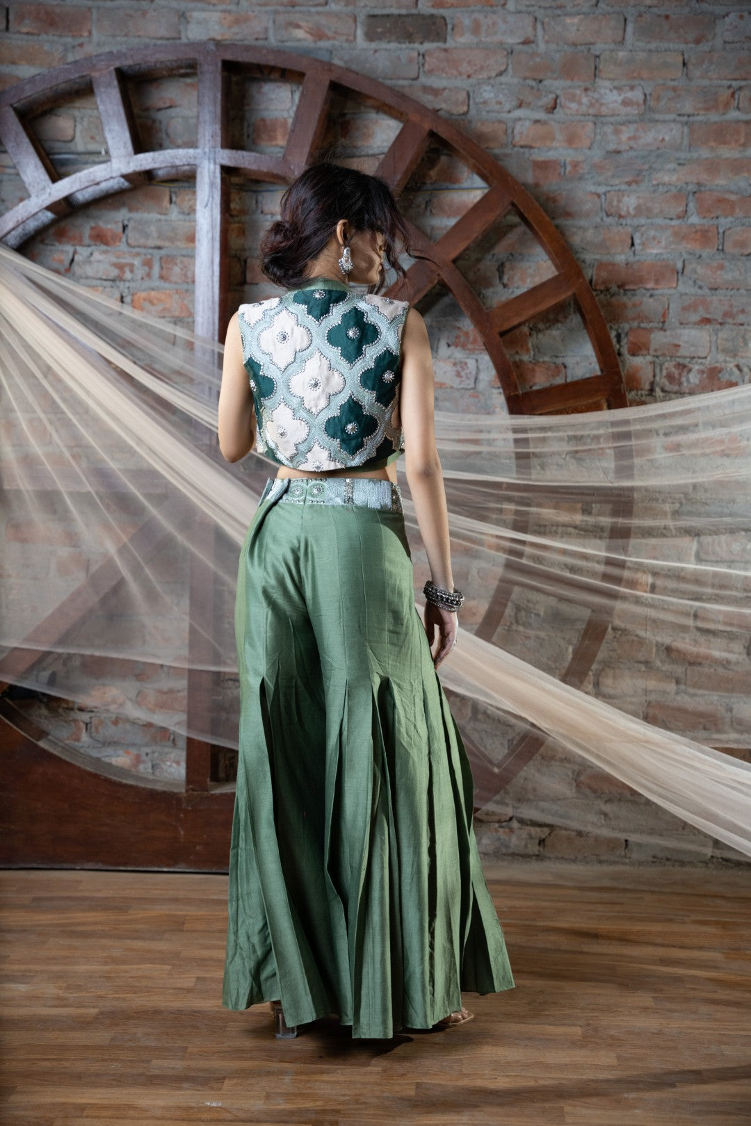 Green appliqué short jacket and plazo set with bustier